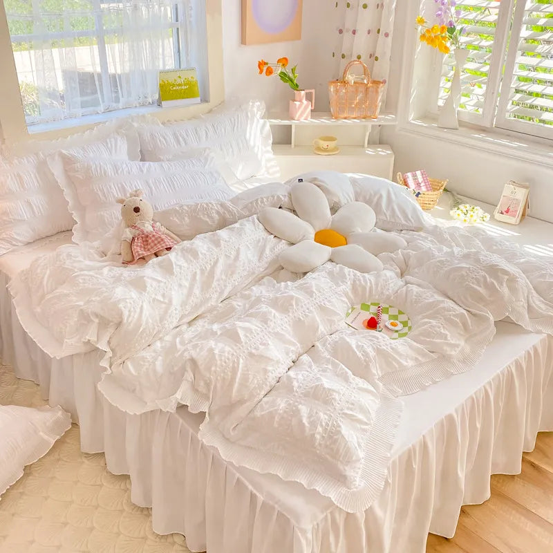 Pink lace plaid bedding set displayed on a vintage white bed frame