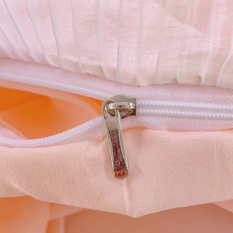 Lace bedding set close-up showing ruffle stitching and plaid texture