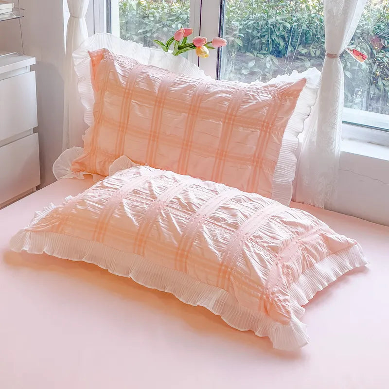 Pink princess plaid cover set styled with cozy morning coffee scene.